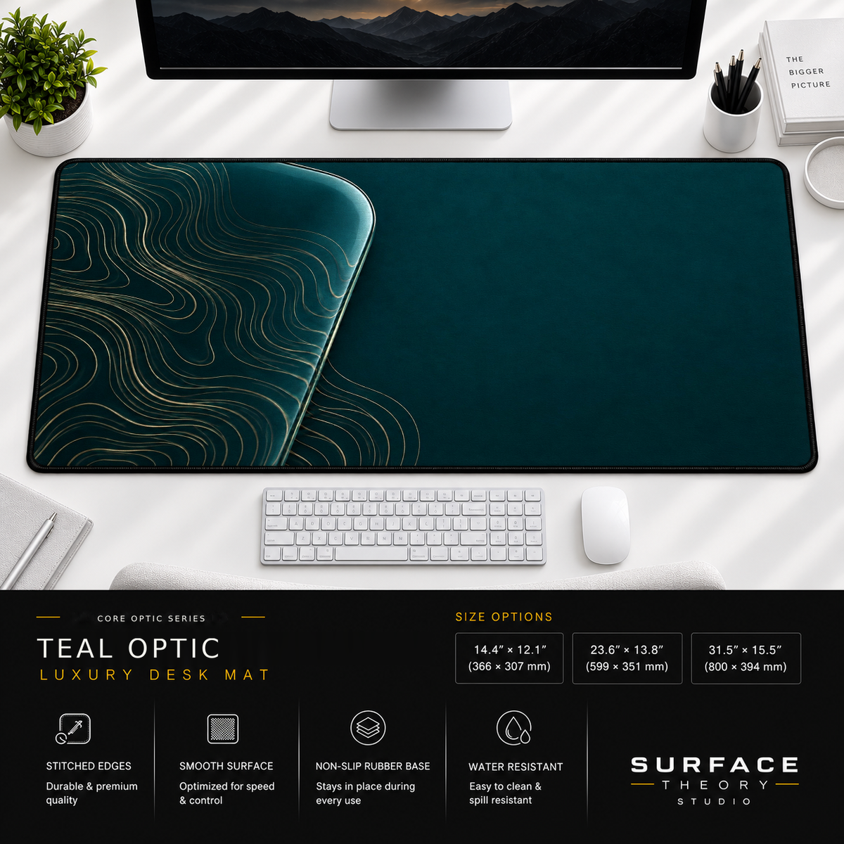 Teal Optic desk mat beneath a monitor on a bright desk with a white keyboard and mouse.
