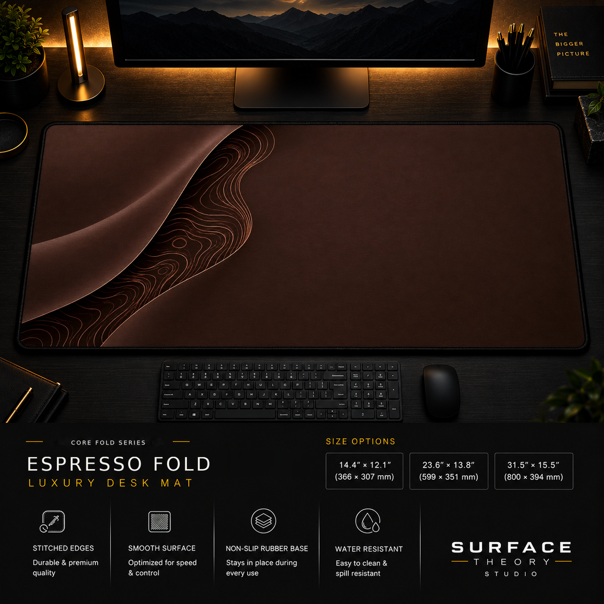 Espresso Fold desk mat in a dark workstation with warm monitor lighting.