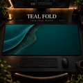 Teal Fold desk mat with a sweeping curve and fine contours along the left in a warm, dark workspace.