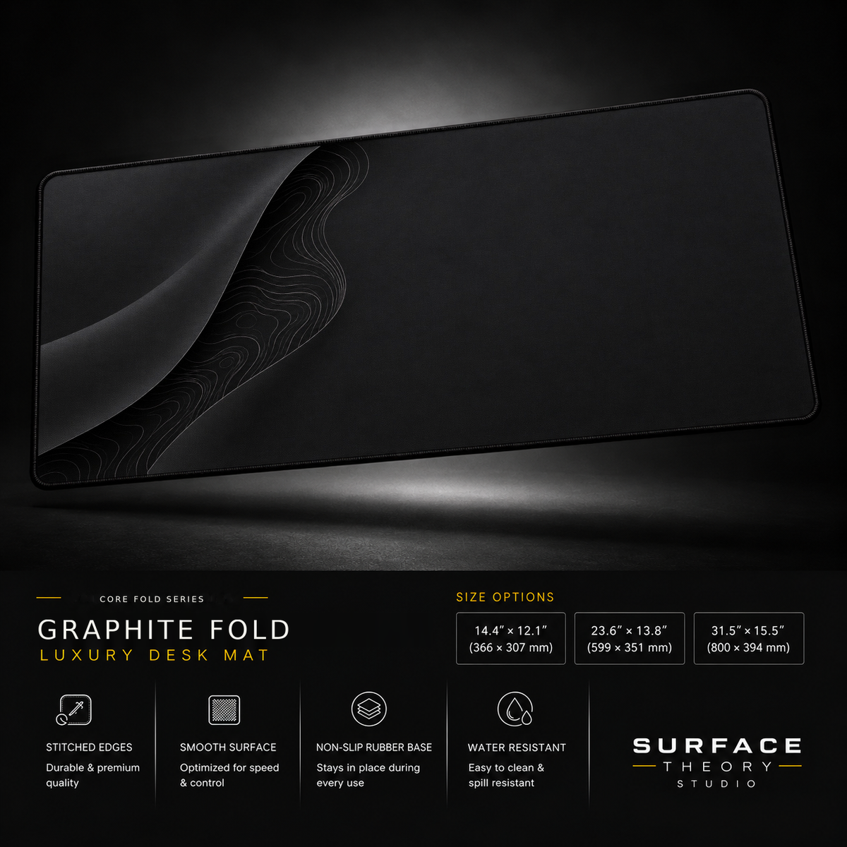 Graphite Fold desk mat floating against a dark studio background.