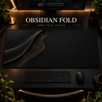 Obsidian Fold desk mat with a sweeping curve and fine contours along the left in a warm, dark workspace.