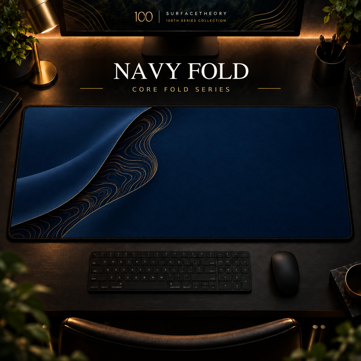 Navy Fold desk mat with a sweeping curve and fine contours along the left in a warm, dark workspace.