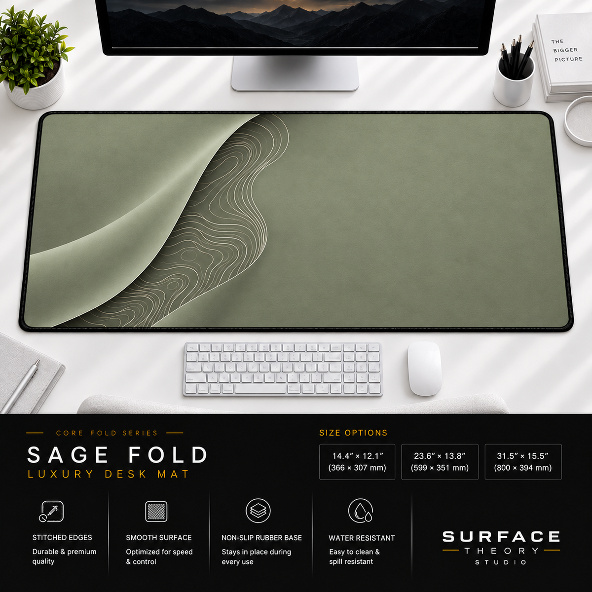 Sage Fold desk mat beneath a monitor on a bright desk with a white keyboard and mouse.