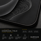 Close-up of Charcoal Fold printed artwork and black stitched corner.