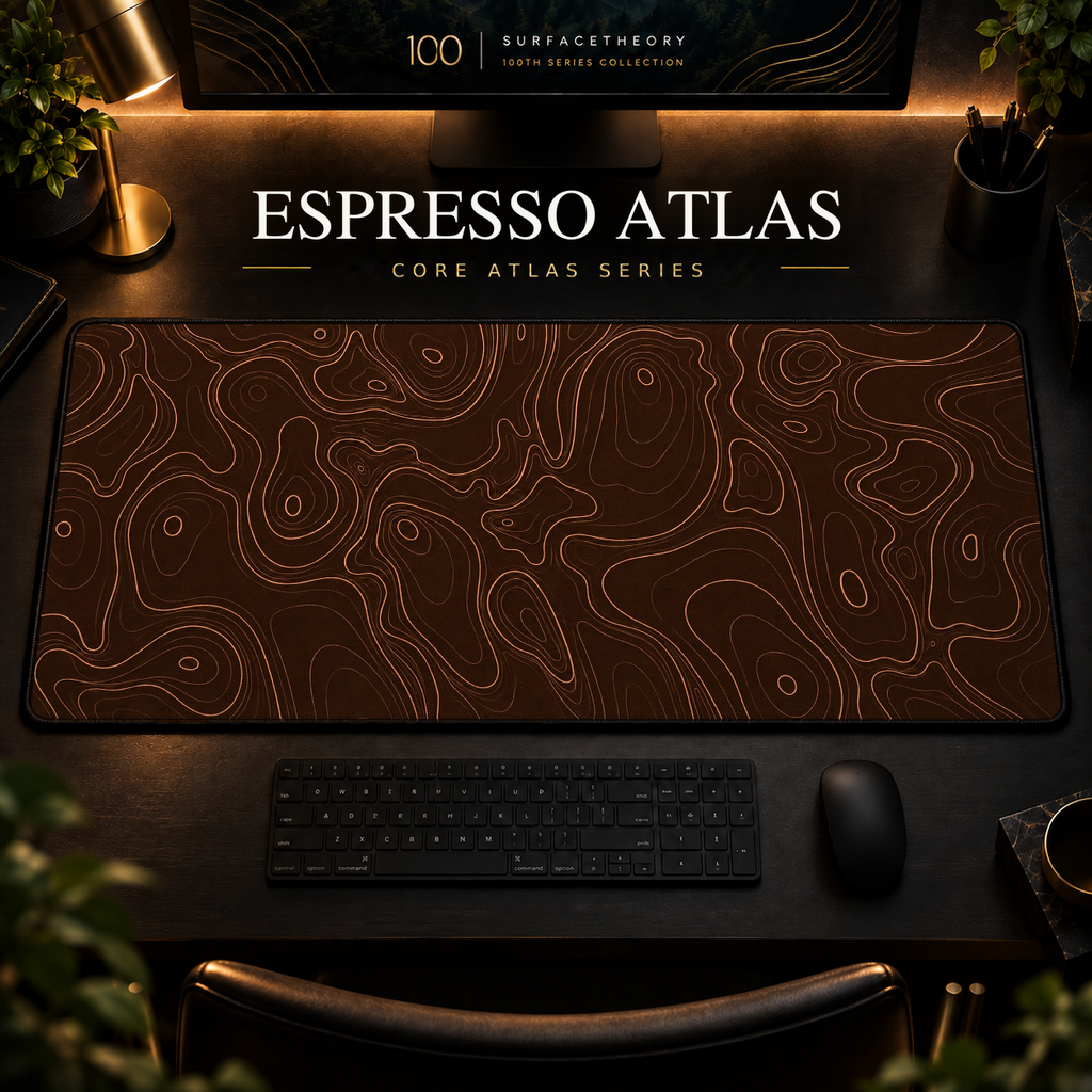 Espresso Atlas desk mat with fine topographic-inspired contours across the full surface in a warm, dark workspace.
