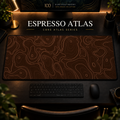 Espresso Atlas desk mat with fine topographic-inspired contours across the full surface in a warm, dark workspace.