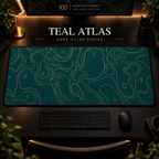 Teal Atlas desk mat with fine topographic-inspired contours across the full surface in a warm, dark workspace.