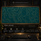 Teal Atlas desk mat in a gold-toned showcase frame above a keyboard.