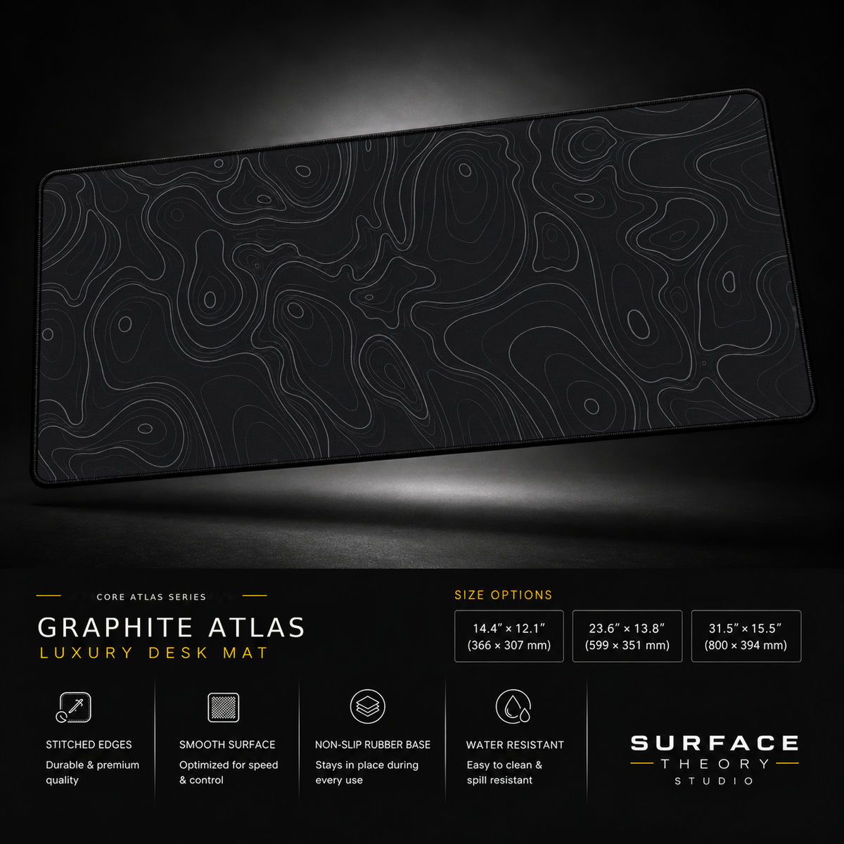 Graphite Atlas desk mat floating against a dark studio background.