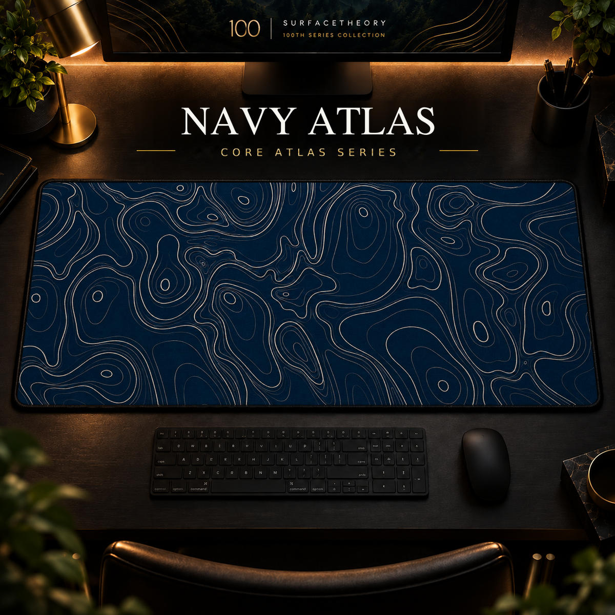 Navy Atlas desk mat with fine topographic-inspired contours across the full surface in a warm, dark workspace.