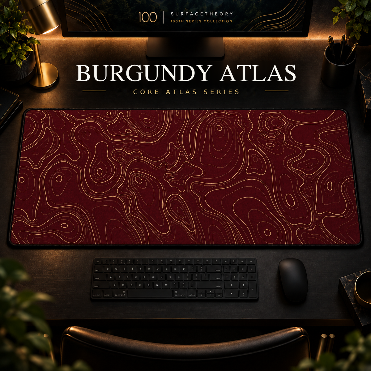 Burgundy Atlas desk mat with fine topographic-inspired contours across the full surface in a warm, dark workspace.