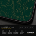 Close-up of Forest Atlas printed artwork and black stitched corner.