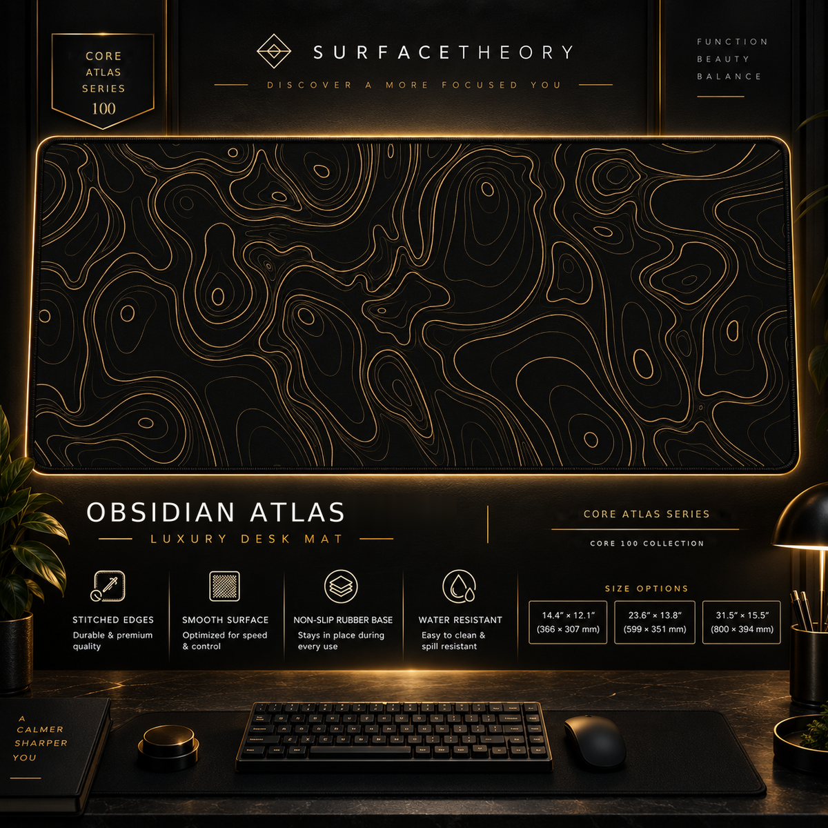Obsidian Atlas desk mat in a gold-toned showcase frame above a keyboard.