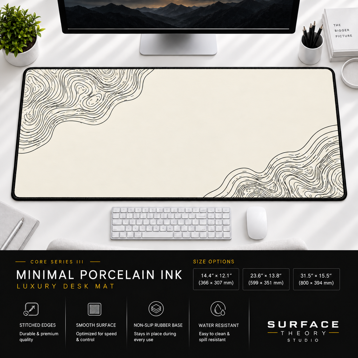 Minimal Porcelain Ink desk mat beneath a monitor on a bright desk with a white keyboard and mouse.