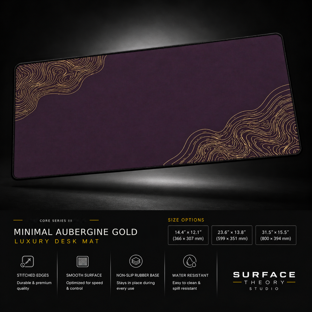Minimal Aubergine Gold desk mat floating against a dark studio background.