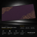Minimal Aubergine Gold desk mat floating against a dark studio background.