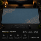 Minimal Slate Copper desk mat in a dark workstation with warm monitor lighting.