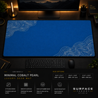 Minimal Cobalt Pearl desk mat in a dark workstation with warm monitor lighting.