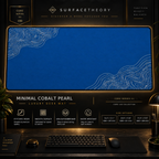Minimal Cobalt Pearl desk mat in a gold-toned showcase frame above a keyboard.