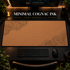 Minimal Cognac Ink desk mat with fine contours in opposing corners in a warm, dark workspace.