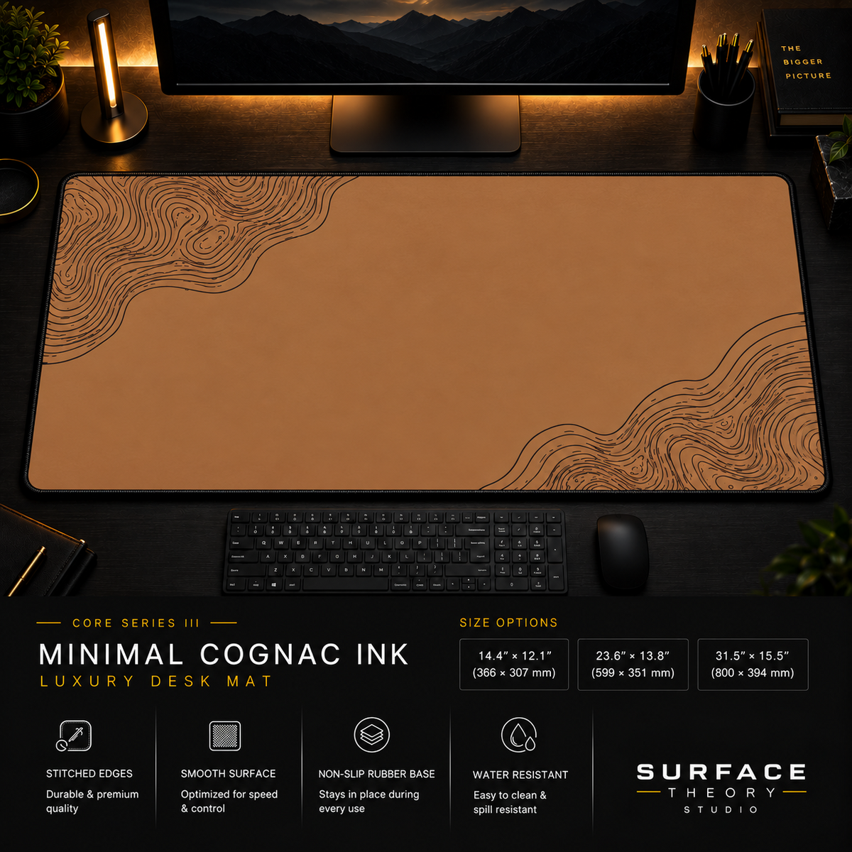 Minimal Cognac Ink desk mat in a dark workstation with warm monitor lighting.