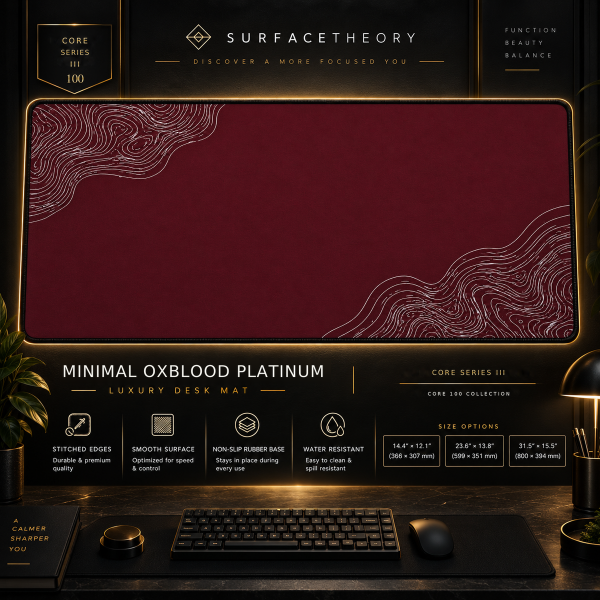 Minimal Oxblood Platinum desk mat in a gold-toned showcase frame above a keyboard.