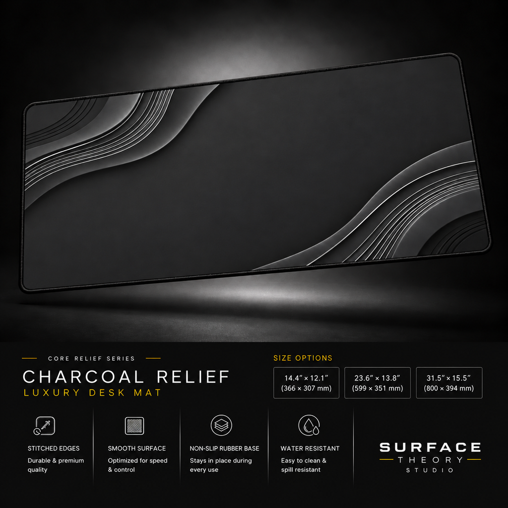 Charcoal Relief desk mat floating against a dark studio background.
