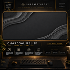 Charcoal Relief desk mat in a gold-toned showcase frame above a keyboard.