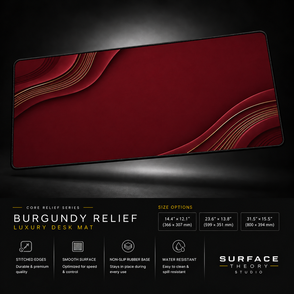 Burgundy Relief desk mat floating against a dark studio background.