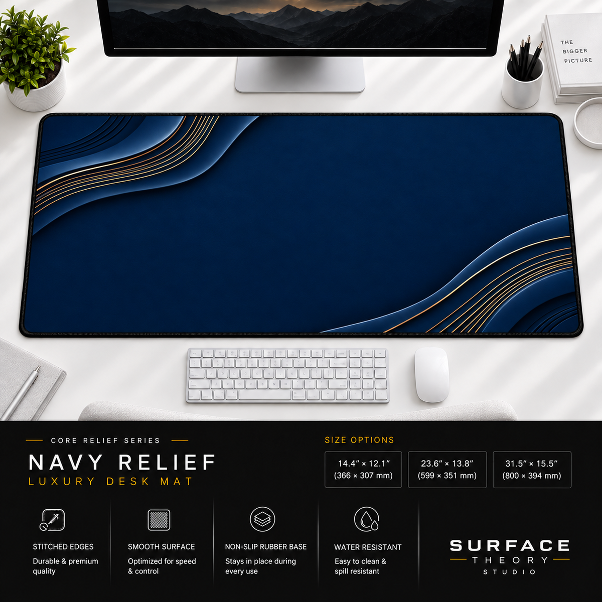 Navy Relief desk mat beneath a monitor on a bright desk with a white keyboard and mouse.