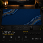 Navy Relief desk mat in a dark workstation with warm monitor lighting.