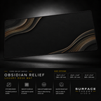 Obsidian Relief desk mat floating against a dark studio background.