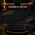 Obsidian Relief desk mat in a warm, dark workspace.