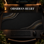 Obsidian Relief desk mat in a warm, dark workspace.