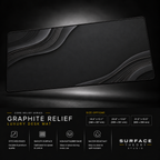 Graphite Relief desk mat floating against a dark studio background.