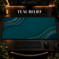 Teal Relief desk mat in a warm, dark workspace.