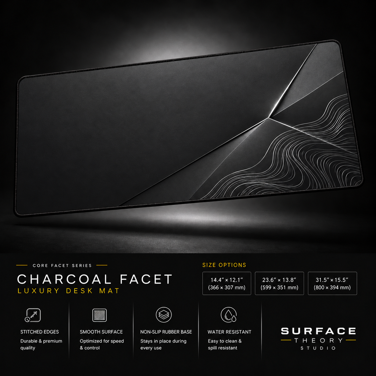 Charcoal Facet desk mat floating against a dark studio background.