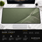 Sage Facet desk mat beneath a monitor on a bright desk with a white keyboard and mouse.