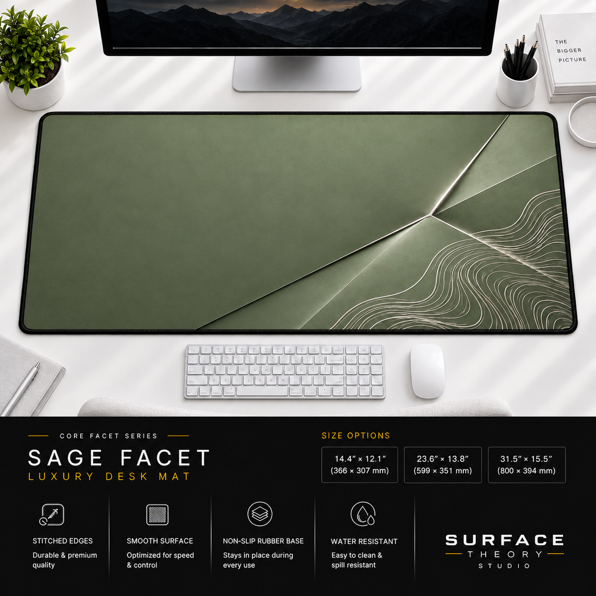 Sage Facet desk mat beneath a monitor on a bright desk with a white keyboard and mouse.
