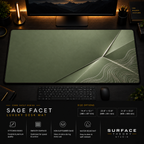 Sage Facet desk mat in a dark workstation with warm monitor lighting.