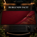 Burgundy Facet desk mat in a warm, dark workspace.