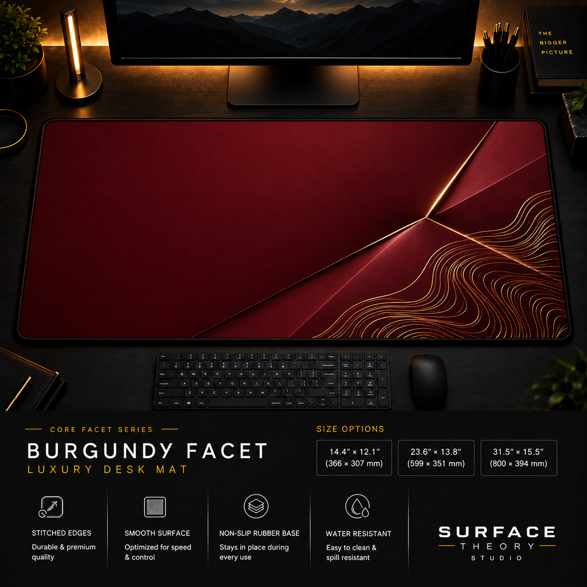 Burgundy Facet desk mat in a dark workstation with warm monitor lighting.