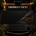 Obsidian Facet desk mat in a warm, dark workspace.
