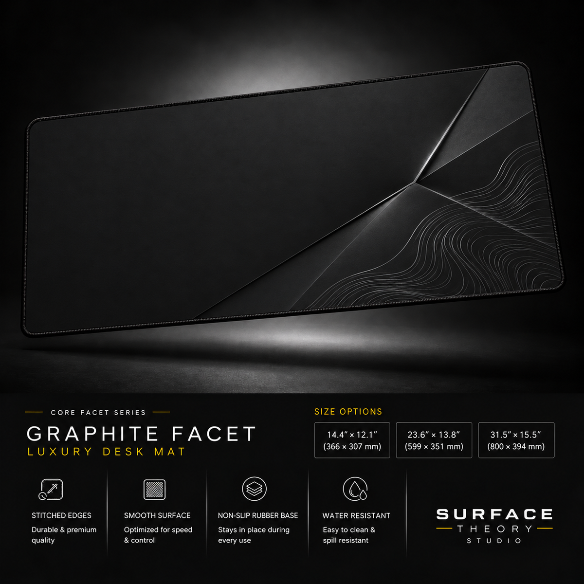 Graphite Facet desk mat floating against a dark studio background.