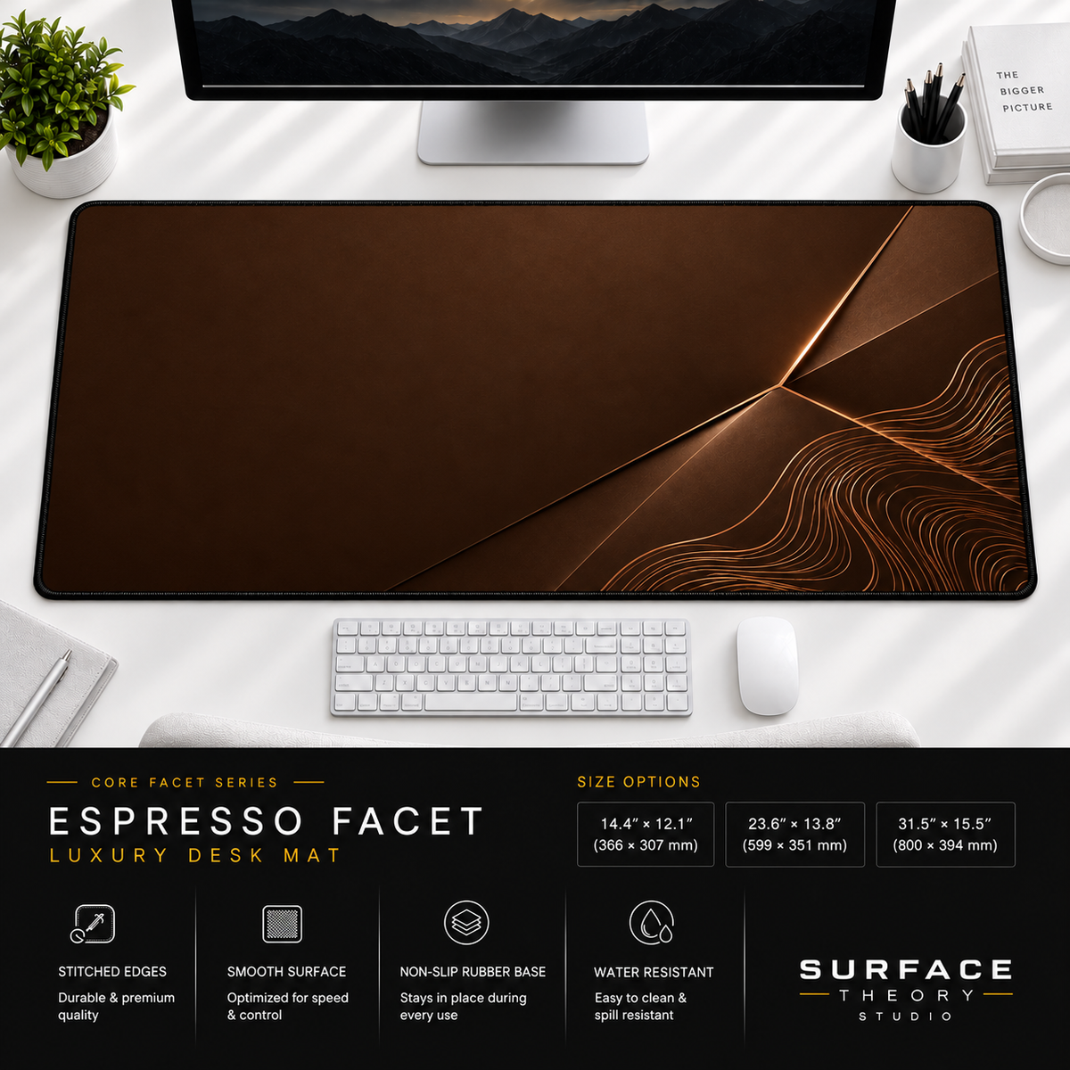 Espresso Facet desk mat beneath a monitor on a bright desk with a white keyboard and mouse.