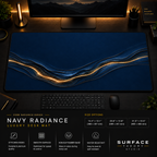 Navy Radiance desk mat in a dark workstation with warm monitor lighting.