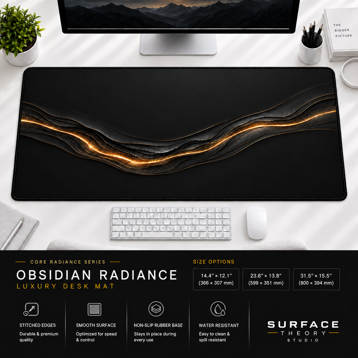 Obsidian Radiance desk mat beneath a monitor on a bright desk with a white keyboard and mouse.
