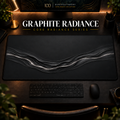 Graphite Radiance desk mat in a warm, dark workspace.