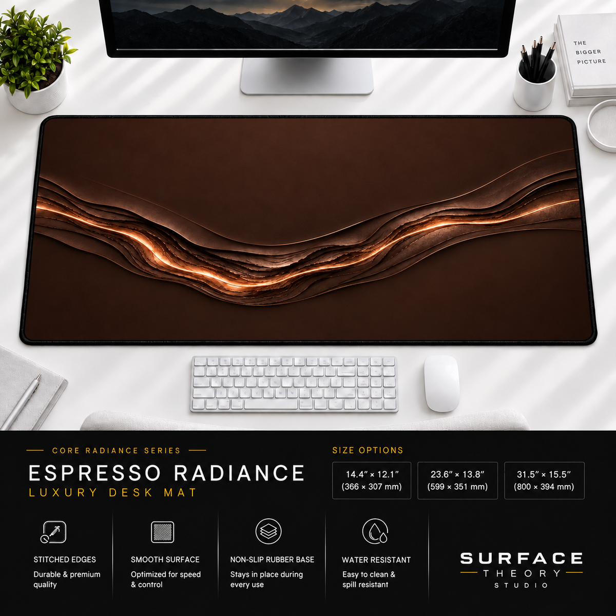 Espresso Radiance desk mat beneath a monitor on a bright desk with a white keyboard and mouse.