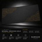 Minimal Obsidian Gold desk mat floating against a dark studio background.